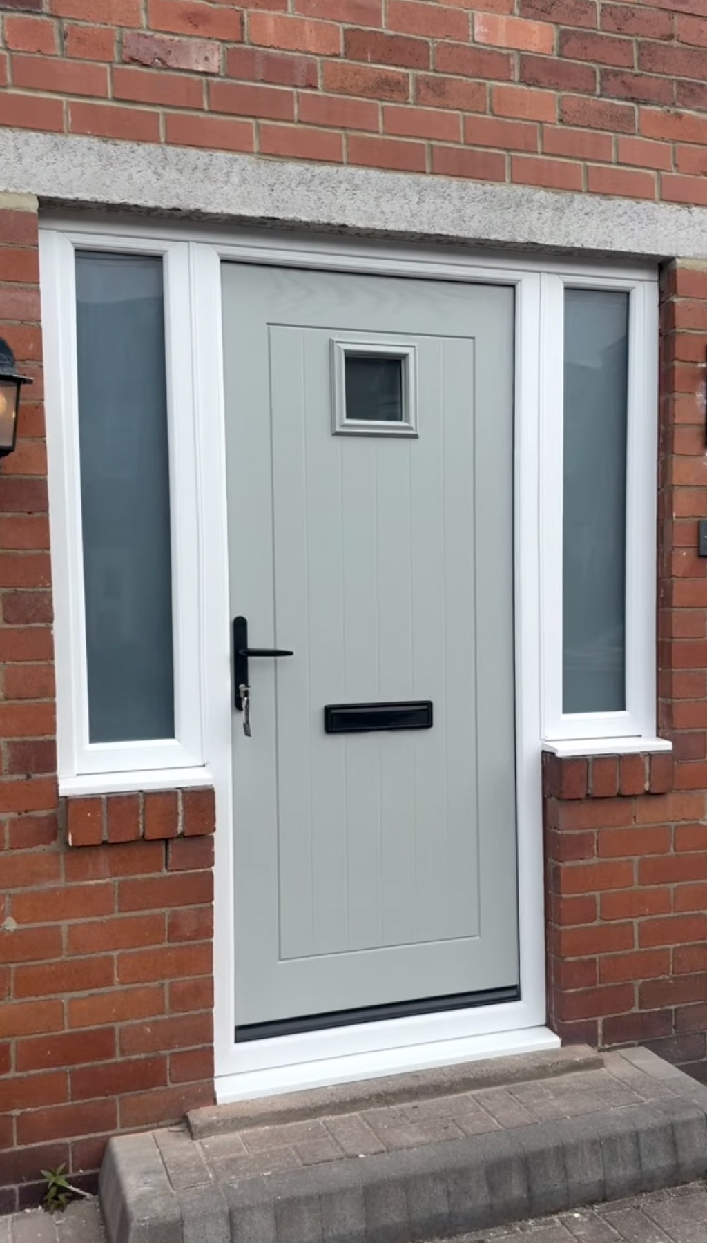 New grey composite front door with sidelights