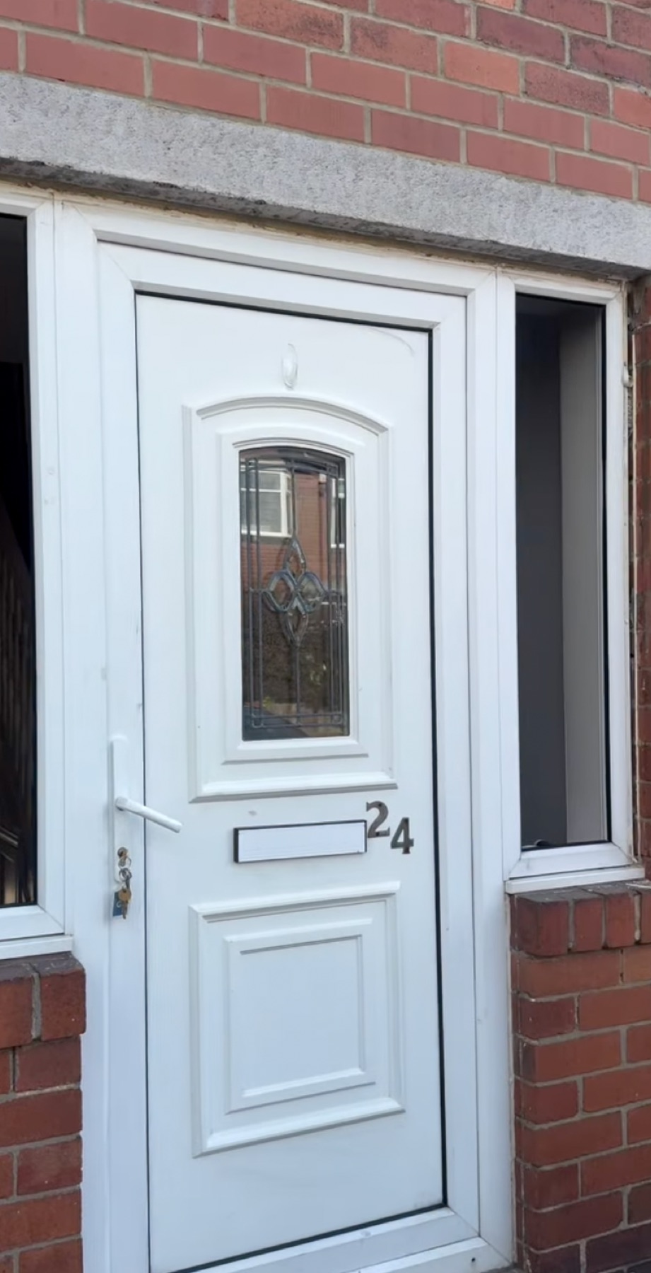The old white uPVC front door before replacement