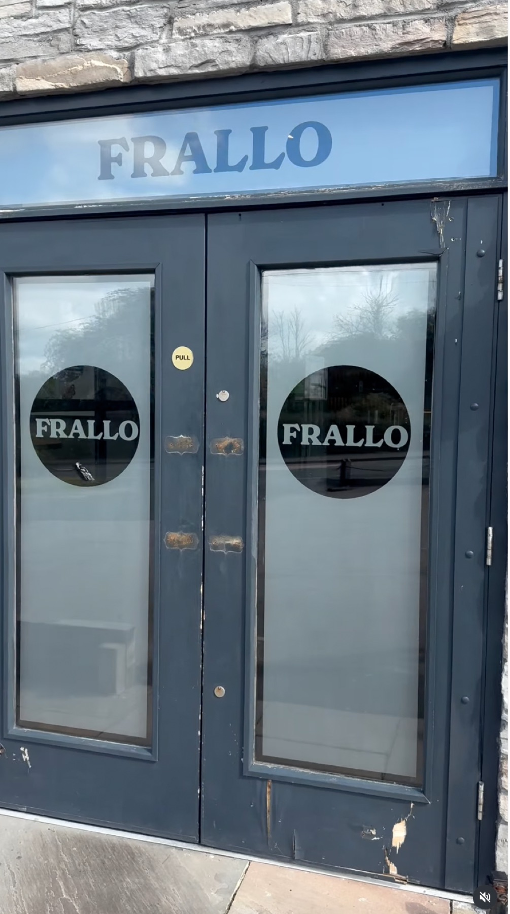The old weathered blue entrance doors at Frallo restaurant