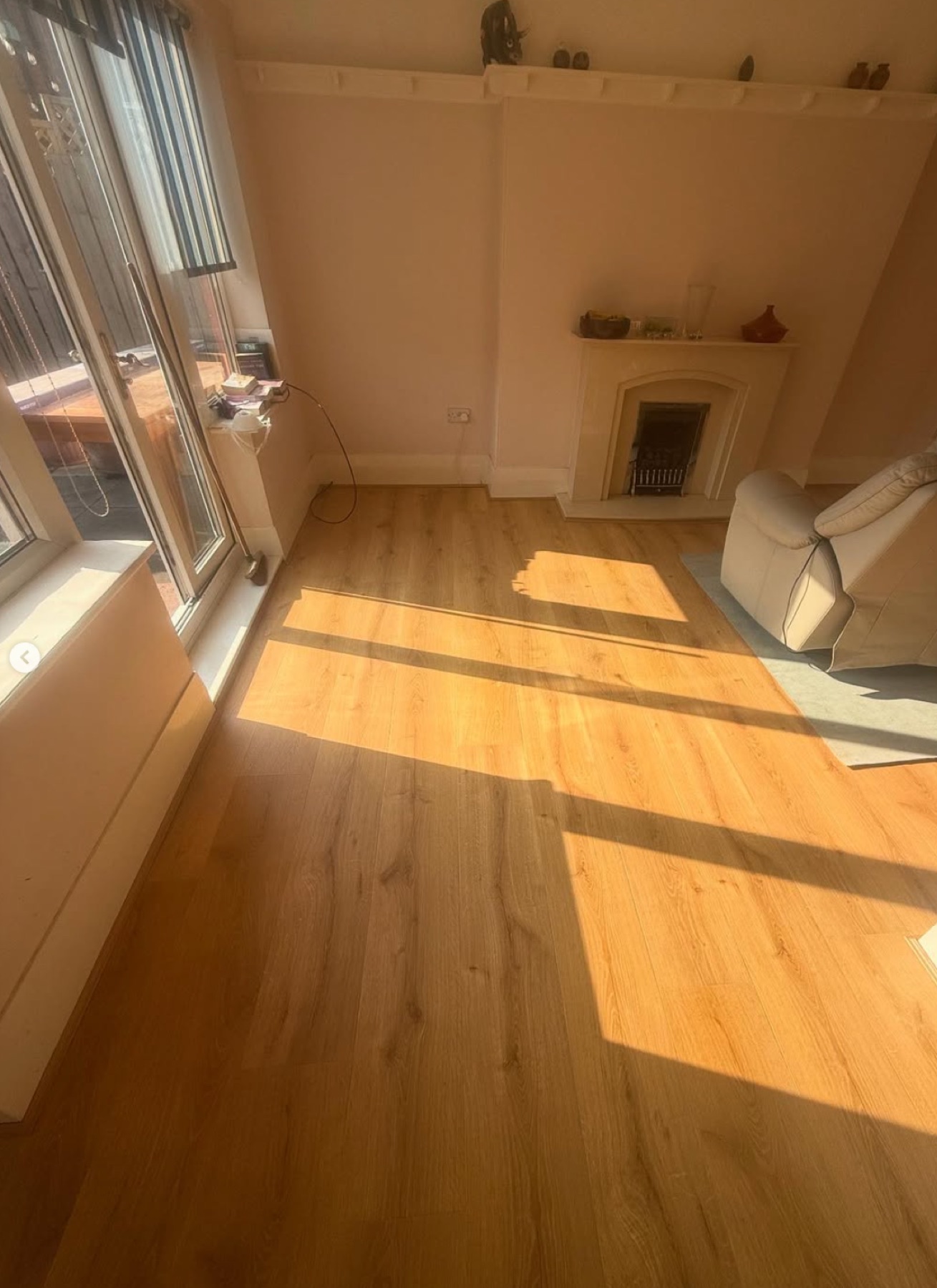 Finished oak-effect living-room floor laid over new joists