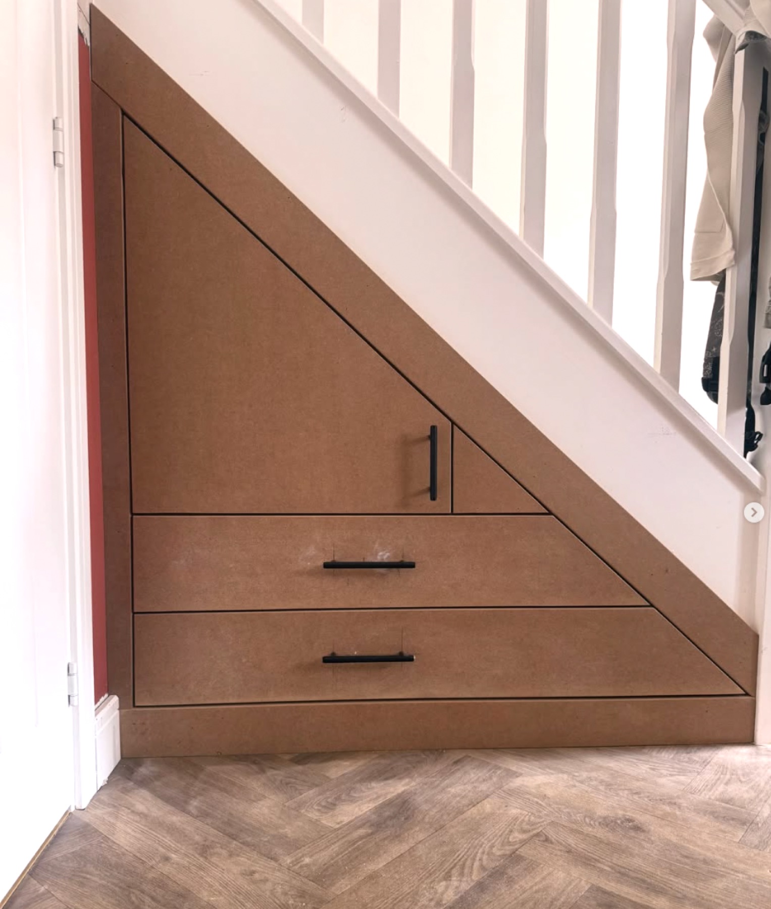 Under-stair storage with drawers and cupboard